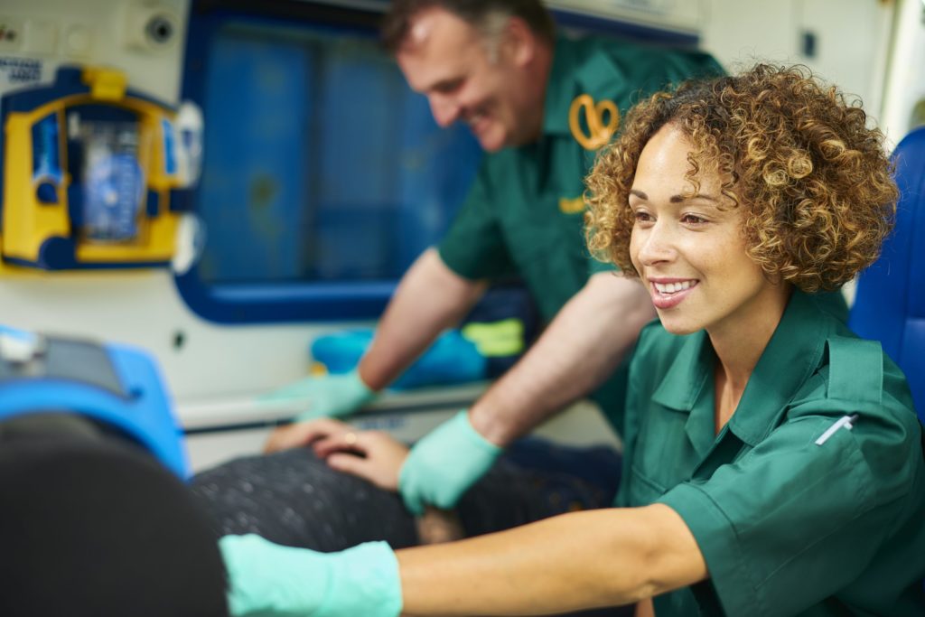 Ambulance worker smiling at patient