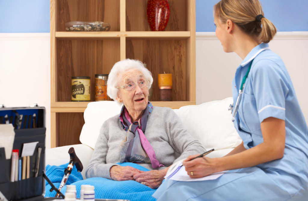 Nurse asking older patient questions